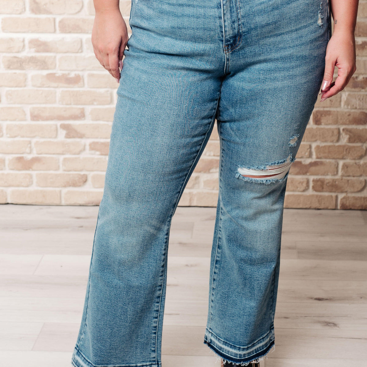 Isla Mid Rise Distressed Released Hem Bootcut Jeans - Three Mad Hatters Mercantile 