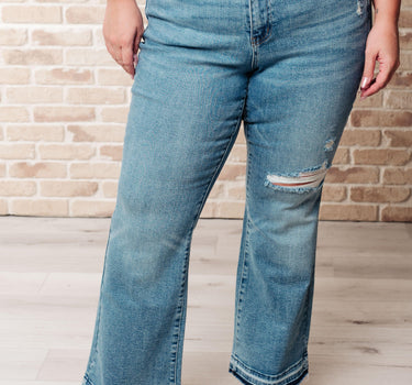 Isla Mid Rise Distressed Released Hem Bootcut Jeans