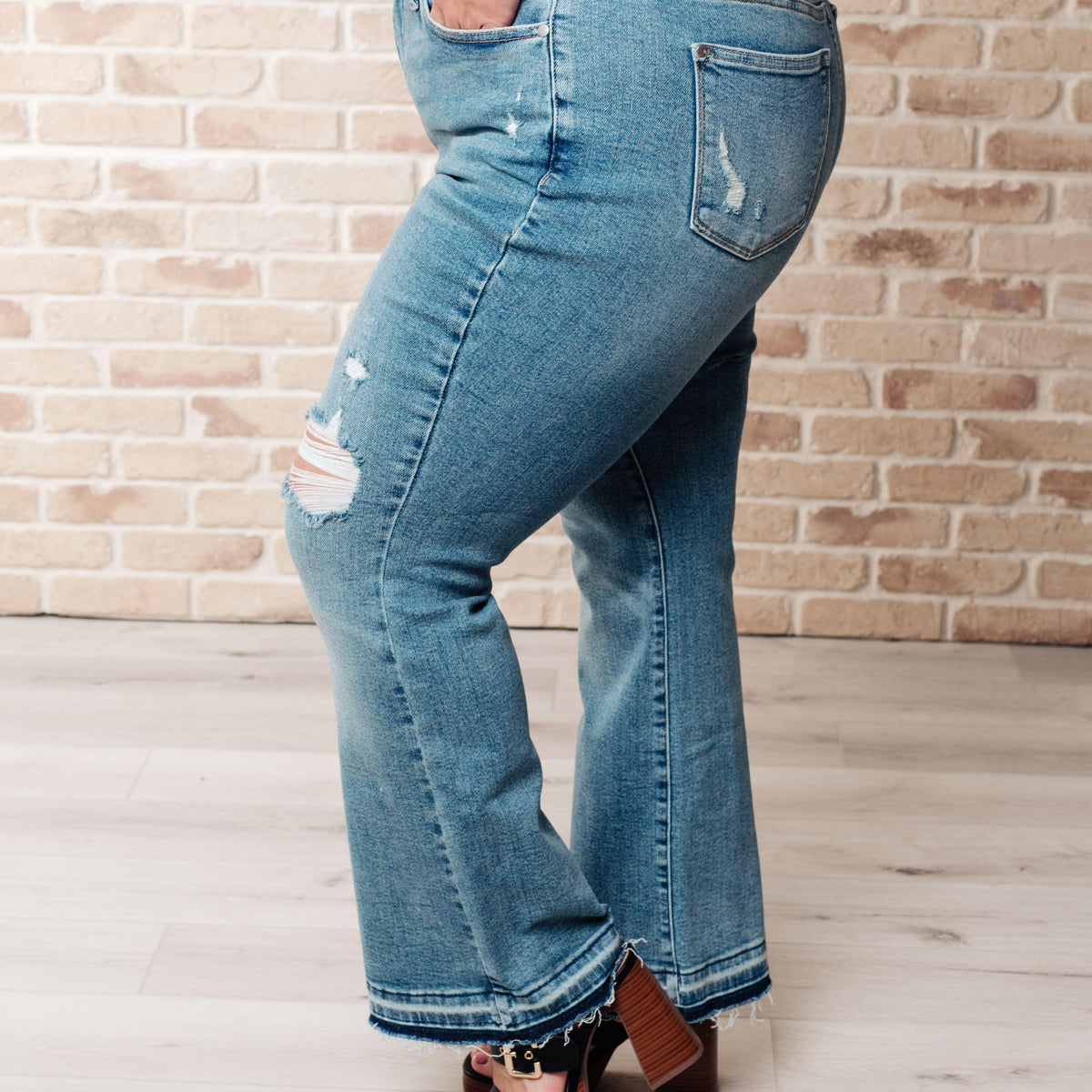 Isla Mid Rise Distressed Released Hem Bootcut Jeans - Three Mad Hatters Mercantile 
