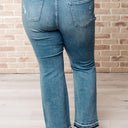 Isla Mid Rise Distressed Released Hem Bootcut Jeans