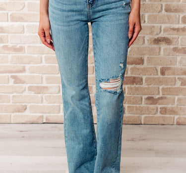 Isla Mid Rise Distressed Released Hem Bootcut Jeans
