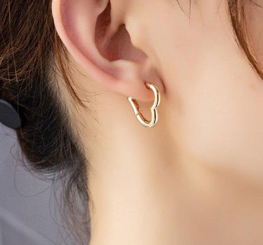 Heart shape hinged huggie hoop earrings