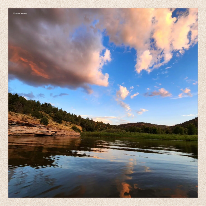 Scenic view of a lake with mountains and clouds reflecting in the water | Caleb Capehart Artisan Gallery | Three Mad Hatters Mercantile | Jackson, MS