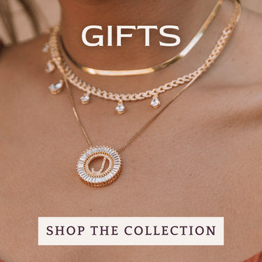 Necklaces on a person with 'Gifts' and 'Shop the Collection' text overlay | Three Mad Hatters Mercantile | Jackson, MS