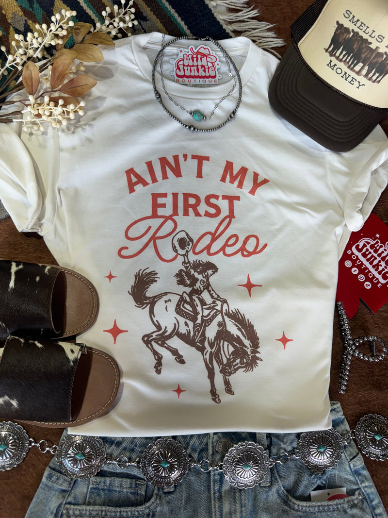 Ain't My First Rodeo Cowgirl Graphic Tee Graphic Tees   