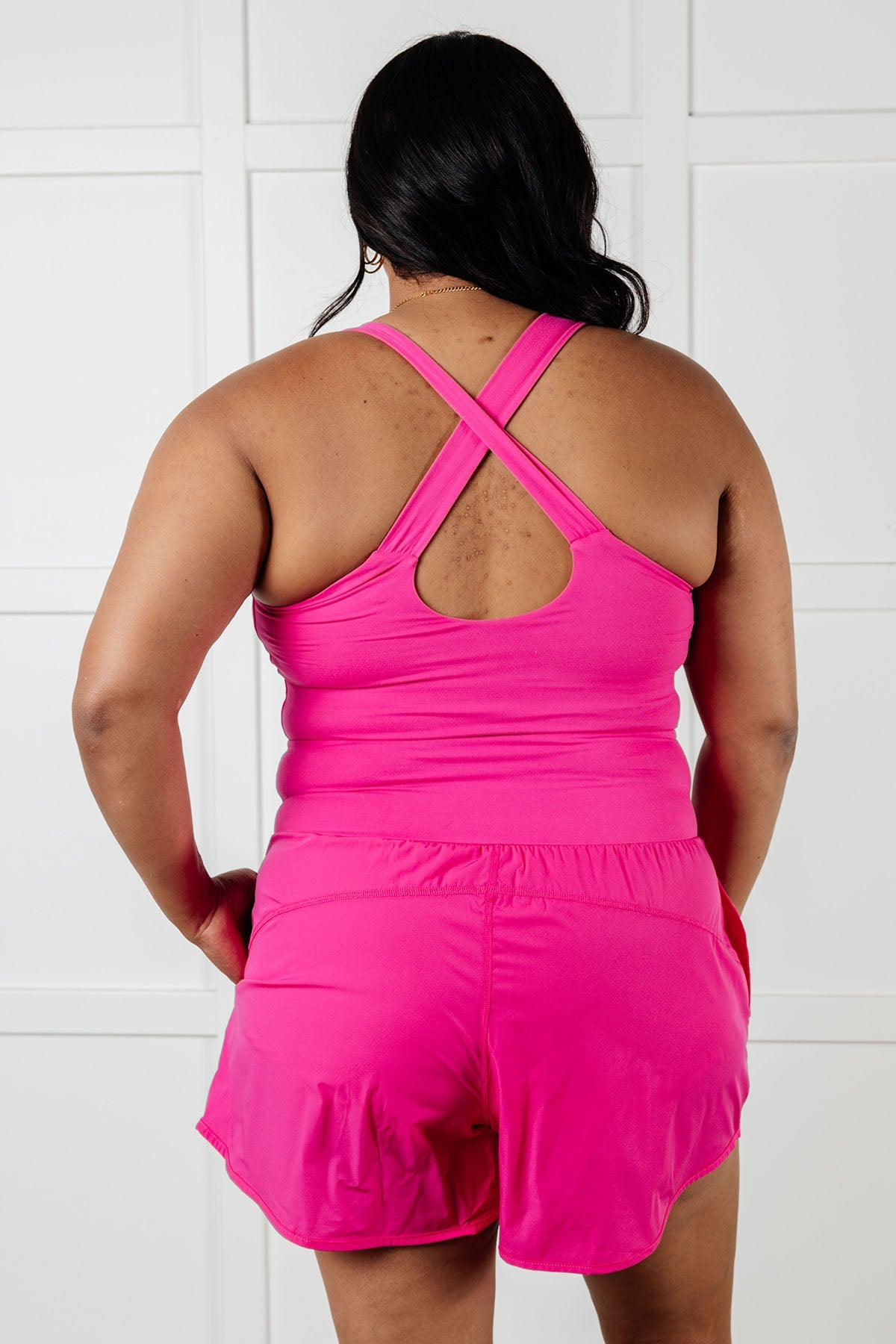 Raising Heart Rate Cutout Runsie In Sonic Pink Athleisure