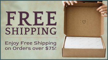 Open cardboard box with free shipping offer text on a beige background | Free US shipping on orders over $75 | Three Mad Hatters Mercantile | Jackson, MS