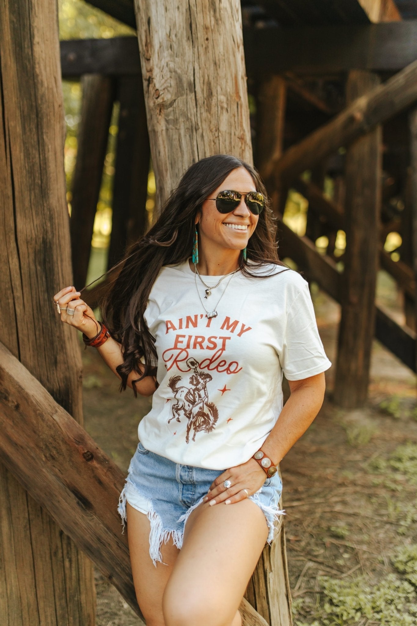 Ain't My First Rodeo Cowgirl Graphic Tee Graphic Tees   